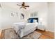 Comfortable bedroom features stylish decor, a ceiling fan, and natural light at 4197 S Grant St, Englewood, CO 80113
