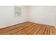 Empty bedroom with hardwood floors and natural light at 4197 S Grant St, Englewood, CO 80113
