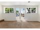 Bedroom with carpet, white walls and glass patio doors leading to backyard at 4197 S Grant St, Englewood, CO 80113