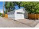 Detached two-car garage in a well-maintained condition with siding in a fenced backyard at 4197 S Grant St, Englewood, CO 80113