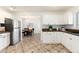 Lovely kitchen offering stainless appliances, granite counters and tile flooring adjoins a breakfast nook at 4197 S Grant St, Englewood, CO 80113