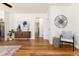 Bright living room features hardwood floors, a ceiling fan, and stylish decor at 4197 S Grant St, Englewood, CO 80113