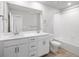 Bright bathroom features double vanity, tub, wood style flooring, and brushed fixtures at 14451 Pansy Loop, Morrison, CO 80465