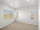 Comfortable bedroom featuring multiple windows for natural light and neutral decor to create a relaxing ambiance at 14451 Pansy Loop, Morrison, CO 80465