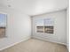 Bedroom with carpeted floors, two large windows, and great light at 14451 Pansy Loop, Morrison, CO 80465