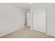 Bedroom featuring neutral paint, carpet, and closet with bi-fold doors at 14451 Pansy Loop, Morrison, CO 80465