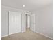 Bedroom featuring carpet and large closet with white bi-fold doors at 14451 Pansy Loop, Morrison, CO 80465