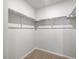 A walk-in closet is equipped with rods and shelves, ideal for organization at 14451 Pansy Loop, Morrison, CO 80465