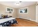 Bedroom featuring hardwood floors, and two windows at 2934 S Columbine St, Denver, CO 80210
