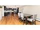 Bright dining area with hardwood floors, and view into updated kitchen at 2934 S Columbine St, Denver, CO 80210