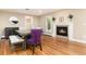 Inviting dining room featuring hardwood floors and a cozy fireplace at 2934 S Columbine St, Denver, CO 80210