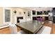 Dining area showcasing a large table, fireplace, and a glimpse into the updated kitchen at 2934 S Columbine St, Denver, CO 80210