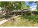 Charming single-story home with a well-maintained lawn, mature trees, and a welcoming walkway at 2934 S Columbine St, Denver, CO 80210