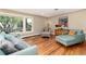 Inviting living room with hardwood floors, large windows, and designer furniture with stylish decor at 2934 S Columbine St, Denver, CO 80210
