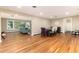 Spacious living room featuring large windows, hardwood floors, and dining area at 2934 S Columbine St, Denver, CO 80210