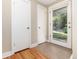 Mud room with tile floor and two white doors near glass exterior door allowing natural light at 2934 S Columbine St, Denver, CO 80210
