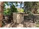 Backyard shed featuring a wooden exterior and surrounding fence at 2934 S Columbine St, Denver, CO 80210