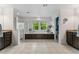 Bright bathroom with soaking tub under windows, glass shower, and entry to private water closet at 1480 Sterling Hill Ct, Castle Rock, CO 80104