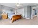Bedroom with wood sleigh bed and adjacent hallway at 1480 Sterling Hill Ct, Castle Rock, CO 80104
