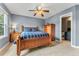 Bedroom featuring a ceiling fan and a wooden bed frame with a blue plaid comforter at 1480 Sterling Hill Ct, Castle Rock, CO 80104