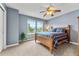 Bedroom featuring carpet, ceiling fan, wooden bed frame, and windows that let in natural light at 1480 Sterling Hill Ct, Castle Rock, CO 80104