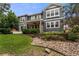 Charming two-story home with a well-manicured lawn and beautiful landscaping at 1480 Sterling Hill Ct, Castle Rock, CO 80104