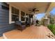 Inviting front porch with comfortable seating, ceiling fan, and grill, perfect for relaxing outdoors at 1480 Sterling Hill Ct, Castle Rock, CO 80104