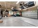 Garage with overhead storage and epoxy flooring at 1480 Sterling Hill Ct, Castle Rock, CO 80104