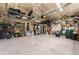 Spacious garage with ample storage, overhead racks, and epoxy flooring at 1480 Sterling Hill Ct, Castle Rock, CO 80104