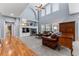 Open concept living room with hardwood floors and a view of the kitchen at 1480 Sterling Hill Ct, Castle Rock, CO 80104