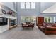 Living room with high ceilings, fireplace, and hardwood floors at 1480 Sterling Hill Ct, Castle Rock, CO 80104