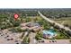 Community center and pool surrounded by lush greenery and residential homes on a sunny day at 2043 Fendlebrush St, Highlands Ranch, CO 80129