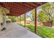 Covered back patio for relaxing or entertaining in a serene, green backyard at 2043 Fendlebrush St, Highlands Ranch, CO 80129