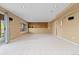 Spacious basement with neutral carpet and sliding glass door to patio at 2043 Fendlebrush St, Highlands Ranch, CO 80129