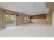 Spacious basement with neutral walls and large sliding glass door at 2043 Fendlebrush St, Highlands Ranch, CO 80129