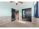 Bedroom featuring closet with mirror and door to hallway at 2043 Fendlebrush St, Highlands Ranch, CO 80129
