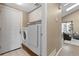 Convenient laundry room with a washer, dryer, and cabinetry for easy organization at 2043 Fendlebrush St, Highlands Ranch, CO 80129