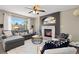 Inviting living room with large windows, a fireplace, and stylish furnishings at 2043 Fendlebrush St, Highlands Ranch, CO 80129