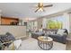 Bright living area connecting to kitchen and dining area, featuring modern decor at 2043 Fendlebrush St, Highlands Ranch, CO 80129