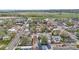 Aerial view shows the neighborhood with tree-lined streets, enhancing the property's appeal in a desirable location at 675 Pierce St, Erie, CO 80516