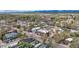 Aerial view showcasing the property nestled in a vibrant neighborhood with mountain views in the distance at 675 Pierce St, Erie, CO 80516