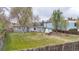 This spacious backyard features a well-maintained lawn, storage shed, and inviting fire pit area at 675 Pierce St, Erie, CO 80516