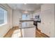 Bright kitchen features white cabinets, granite countertops, stainless appliances, and an island at 23950 E 41St Ave, Aurora, CO 80019