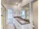Spacious bathroom featuring granite countertops, double sinks, and glass door showers at 23950 E 41St Ave, Aurora, CO 80019