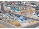 Aerial view showcasing a residential community with well-maintained homes, landscaping, and neighborhood streets at 3385 Birch Rd, Longmont, CO 80504