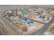 Stunning aerial view of a vibrant community with well-manicured lawns, and a scenic lake nearby at 3385 Birch Rd, Longmont, CO 80504