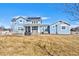Expansive backyard with patio, hot tub, and outdoor seating, perfect for entertaining and relaxing at 3385 Birch Rd, Longmont, CO 80504