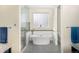 Modern bathroom featuring a soaking tub, glass-enclosed shower, and stylish tile work at 3385 Birch Rd, Longmont, CO 80504