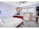 Bright bedroom with large windows, whimsical decor, and a cozy atmosphere, perfect for a  at 3385 Birch Rd, Longmont, CO 80504