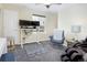 Cozy bedroom includes a modern computer setup, comfortable seating, and ample natural light at 3385 Birch Rd, Longmont, CO 80504